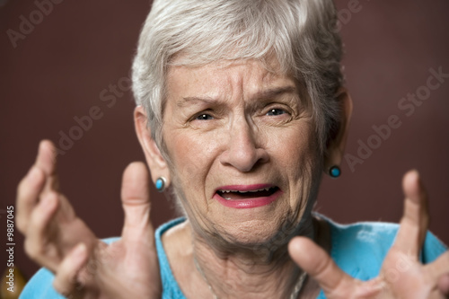 Photo: Upset senior with a worried expression on her face Upset senior with a worried expression on her face