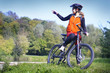 Cyclist pointing at smth