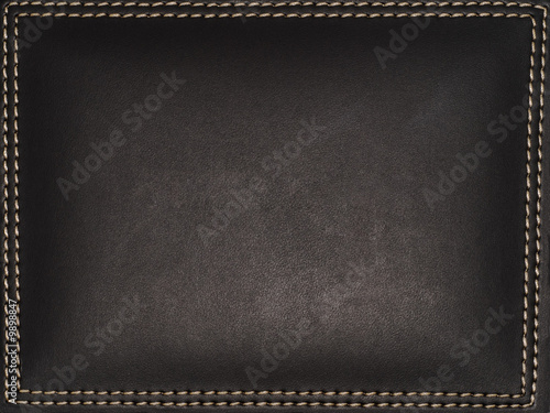 Photo: A dark leather frame with surrounding stitches A dark leather frame with surrounding stitches