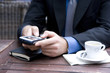 Photo: Businessman in an outside cafe macro Businessman in an outside cafe macro