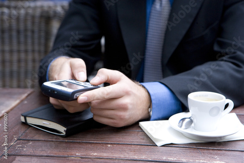 Photo: Businessman in an outside cafe macro Businessman in an outside cafe macro