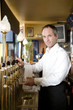 A barman at his bar