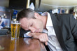 A sad man with a beer