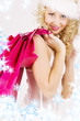 picture of cheerful santa helper girl with shopping bags