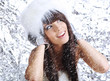 sexy winter girl wearing white fur. blue frozen background