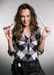 smiley hairdresser with tools against grey background