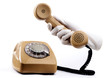 The himan hand holding the telephone receiver