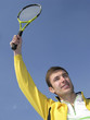 player in tennis on blue background sky iin sunny day