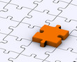 Last orange piece to complete jigsaw puzzle Last orange piece to complete jigsaw puzzle