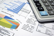 Photo en ligne au meilleur prix Calculator and printed diagrams.