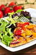 Vegetarian meal of vegetable pizza and green salad