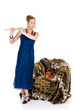 Attractive young female flautist, flutist holding flute.