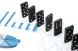 some domino stones on a blue  business chart