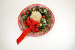 A sombrero decorated with dried and silk flowers for Christmas.