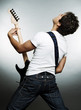 view from behind on the man with guitar over grey background view from behind on the man with guitar over grey background