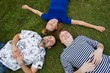 Photo: Three happy friends on the grass. Three happy friends on the grass.