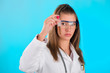 Woman looking at the chemical tube, focus on tube