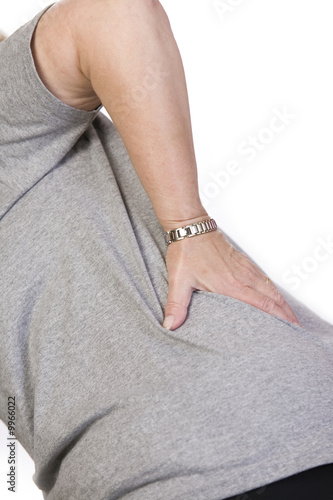 Photo: Woman with hip and back pain Woman with hip and back pain