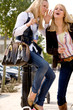 Foto: Two young girls shopping in the sunny weather Two young girls shopping in the sunny weather
