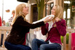 Foto: Two young girls shopping in the sunny weather Two young girls shopping in the sunny weather
