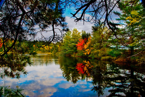 Photo: Fall colors in Canada's Algonquin Park reflected on a lake Fall colors in Canada's Algonquin Park reflected on a lake