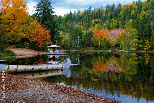 Photo: Fall colors in Canada's Algonquin Park reflected on a lake Fall colors in Canada's Algonquin Park reflected on a lake