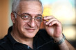 Close-up portrait of a happy elderly man. Shallow DOF.