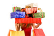 Attractive woman holding many gift boxes and bags