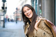 beautiful woman holding shopping bags