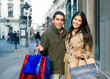 young couple doing shopping at the city center
