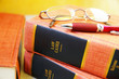 Closeup of law books, glasses and pen