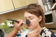A cosmetologist uses powder for a woman