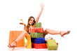 Attractive shopping girl with colorful package and bags.