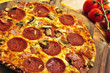 Freshly baked pepperoni pizza on wooden board