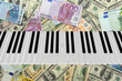 Piano Keyboard  On Dollar And Euro Bills Background. 3d Render..