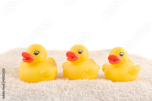 Photo: three child's rubber duck on top of towel ready for bath time three child's rubber duck on top of towel ready for bath time