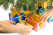 Various gift boxes and fur-tree branch on a white background