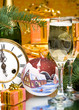 Decoration with clock, firtree, gift boxes and champagne glasses