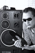 DJ Roman Kravtsov holding vinyl in his hands