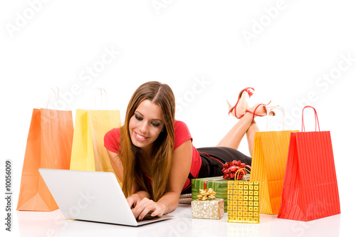 Beautiful young woman shopping over internet