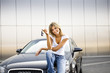 Photo: Young woman holding keys to new car Young woman holding keys to new car
