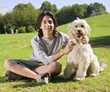 teenager and his dog in the park