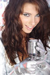 Rock star. Sexy Girl singing in retro mic