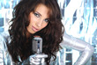 Rock star. Sexy Girl singing in retro mic