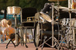 drums set on the scene with people and trees background