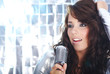 Rock star. Sexy Girl singing in retro mic