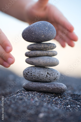 Balanced Stones. Stack of volcanic pebbles on seashore