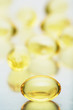 Macro of a bunch of yellow gel pills.