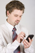 Young businessman is working on PDA