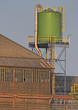 Building and tank in factory complex